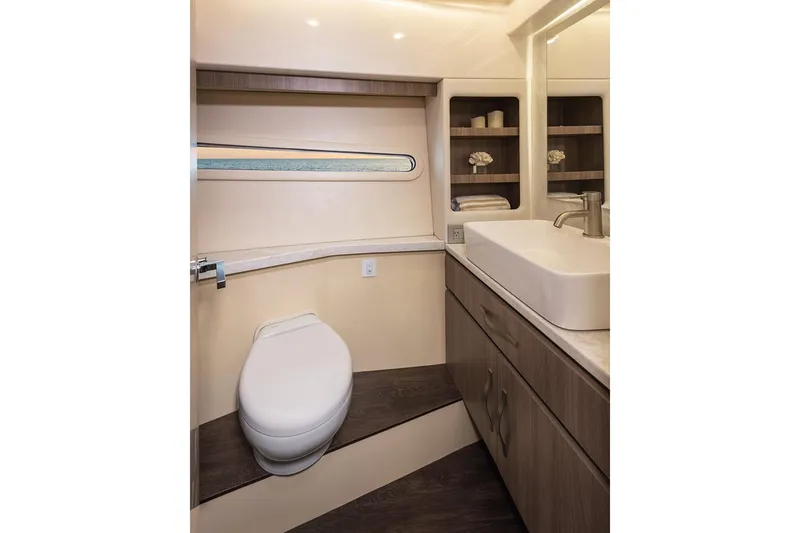 Slide: The Image of Manufacturer Provided Image: 2022 Regal 38 Grande Coupe yacht, rear deck view with water and sky background. - 28