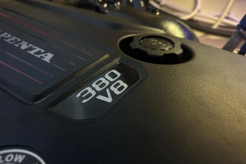 Slide: The Image of 2022 Regal 38 Grande Coupe yacht docked at marina, sleek design, calm waters. - 42