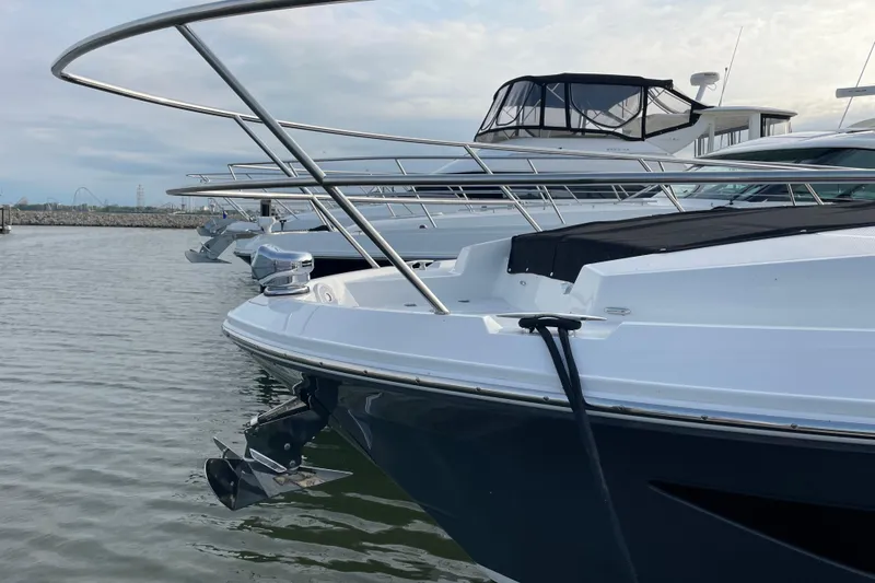 Slide: The Image of Manufacturer Provided Image: 2022 Regal 38 Grande Coupe bow sunpad on water. - 5