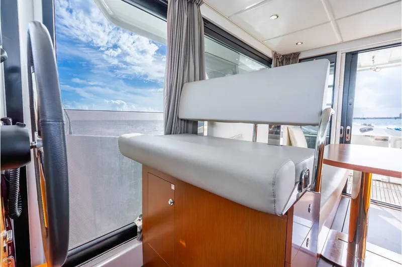 Slide: The Image of Interior of 2017 Beneteau Swift Trawler 30 with helm seat and ocean view. - 15