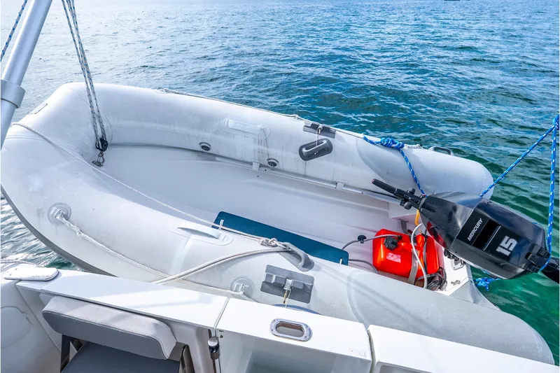Slide: The Image of Inflatable boat with outboard motor on 2017 Beneteau Swift Trawler 30, floating on water. - 24