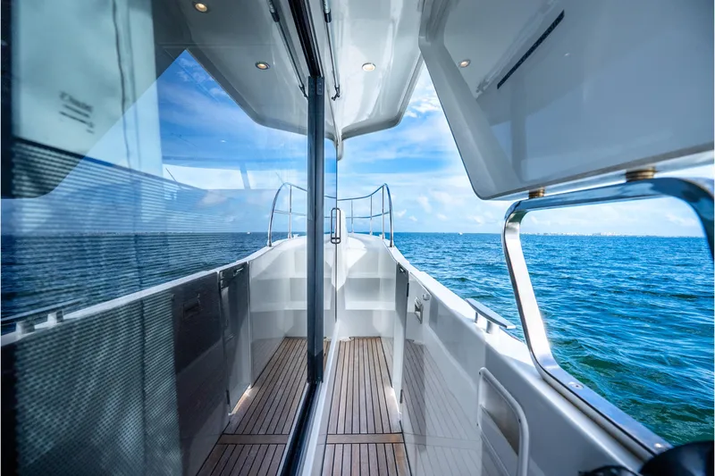 Slide: The Image of 2017 Beneteau Swift Trawler 30, sleek deck view, overlooking serene ocean waters. - 26