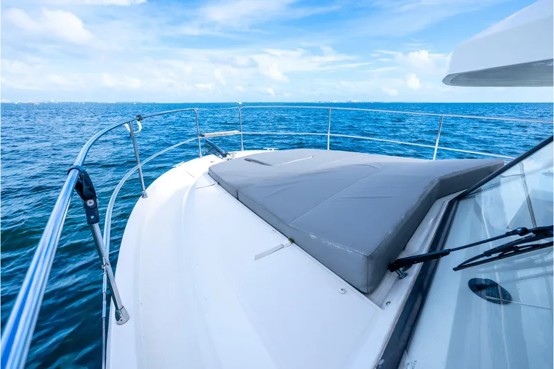 Slide: The Image of 2017 Beneteau Swift Trawler 30 deck view with ocean backdrop. - 27