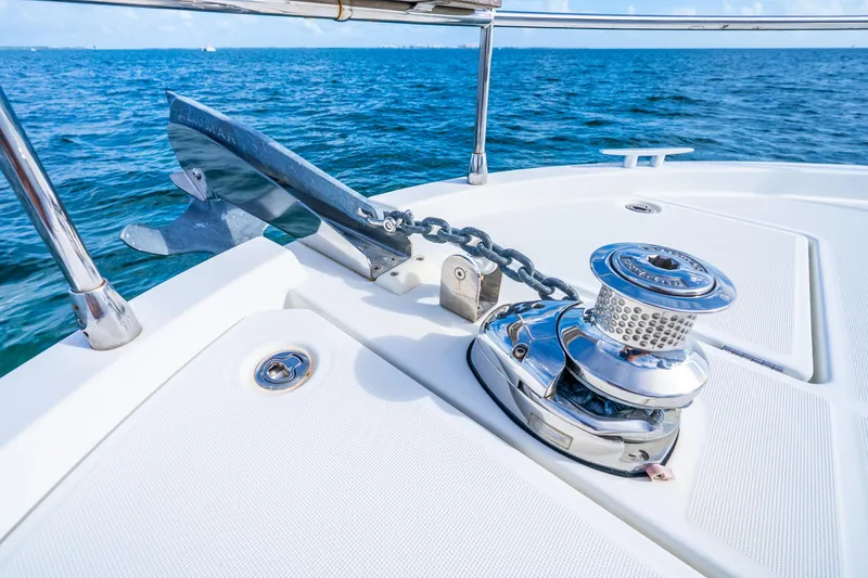 Slide: The Image of 2017 Beneteau Swift Trawler 30 anchor and winch on deck, ocean background. - 28