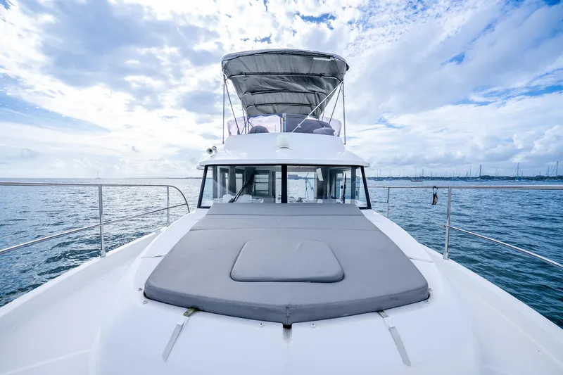 Slide: The Image of 2017 Beneteau Swift Trawler 30 on open water under a cloudy sky. - 29