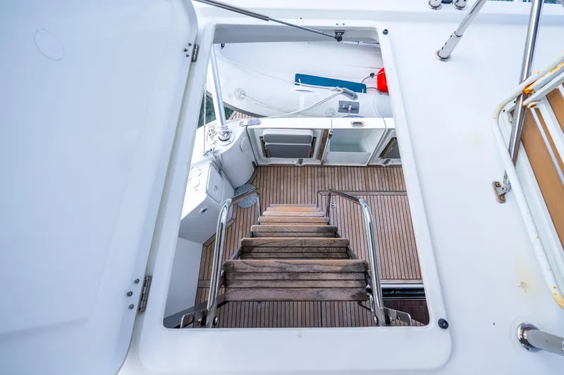 Slide: The Image of Staircase view on 2017 Beneteau Swift Trawler 30, showcasing teak flooring and sleek design. - 31