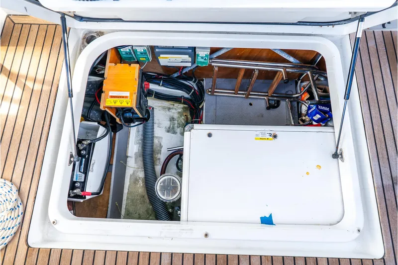 Slide: The Image of Engine compartment of 2017 Beneteau Swift Trawler 30 with visible equipment and wiring. - 40