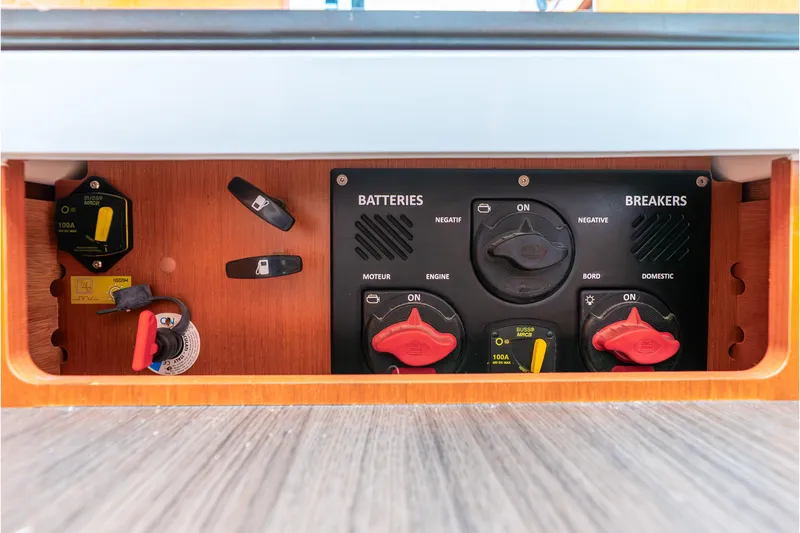 Slide: The Image of Electrical panel of 2017 Beneteau Swift Trawler 30, featuring battery and breaker controls. - 42