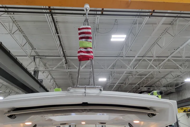 Slide: The Image of 2026 Formula 310 Bowrider OB in a warehouse, featuring a hoisting mechanism. - 20