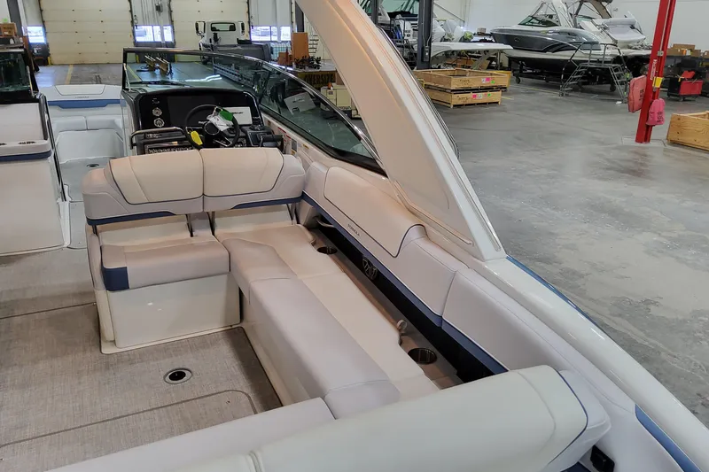 Slide: The Image of 2026 Formula 310 Bowrider OB interior with luxurious seating in a showroom. - 26