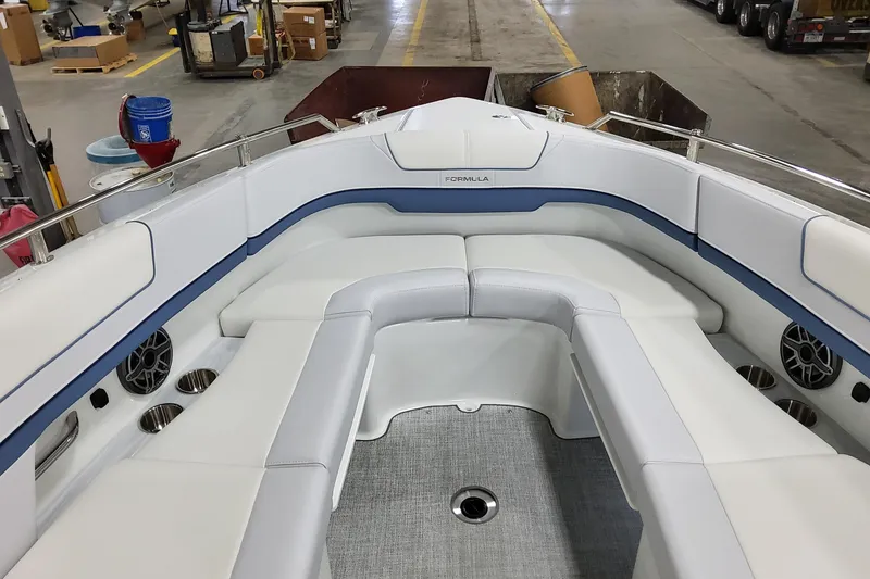 Slide: The Image of Luxurious seating area of 2026 Formula 310 Bowrider OB boat in a workshop setting. - 29