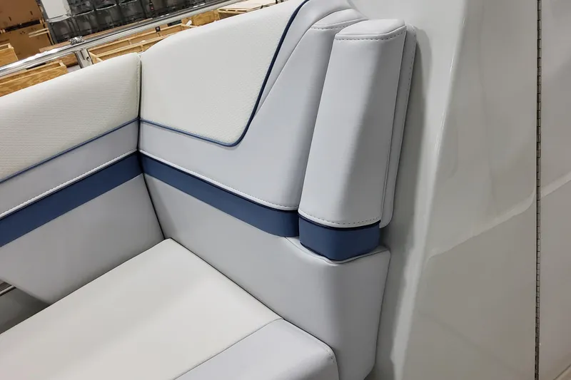 Slide: The Image of 2026 Formula 310 Bowrider OB interior seating with white and blue upholstery. - 31