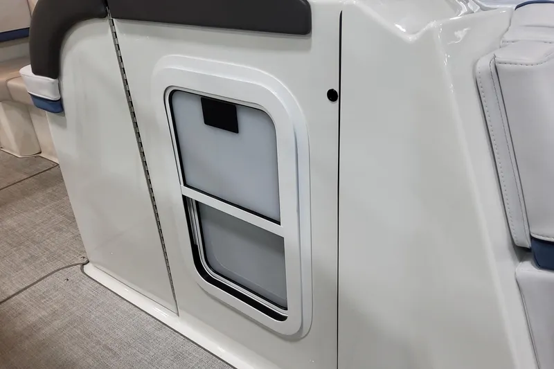 Slide: The Image of 2026 Formula 310 Bowrider OB interior detail, featuring sleek white paneling and seating. - 40