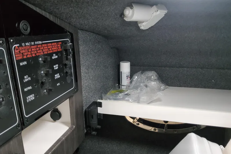 Slide: The Image of Interior of 2026 Formula 310 Bowrider OB showing control panel and storage area. - 41