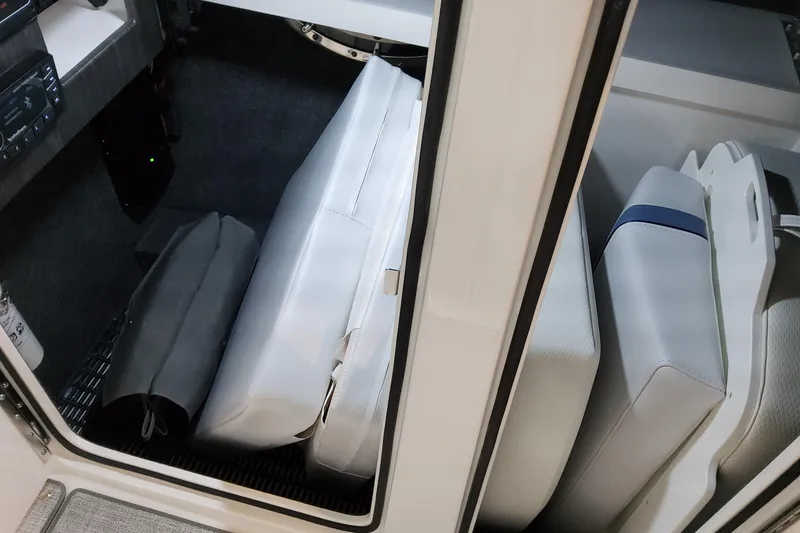 Slide: The Image of Interior storage area of 2026 Formula 310 Bowrider OB with cushions and equipment. - 45