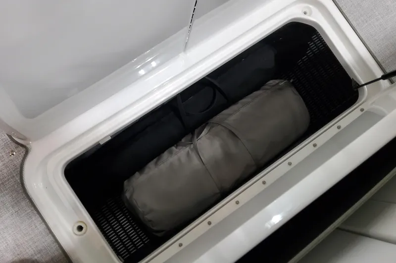 Slide: The Image of Open storage compartment in 2026 Formula 310 Bowrider OB boat. - 47