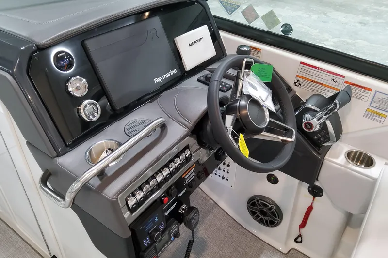 Slide: The Image of 2026 Formula 310 Bowrider OB helm with Raymarine display and Mercury controls. - 50