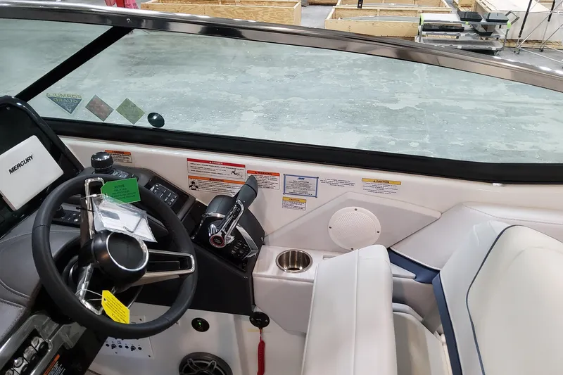 Slide: The Image of 2026 Formula 310 Bowrider OB cockpit with steering wheel, controls, and seating. - 51