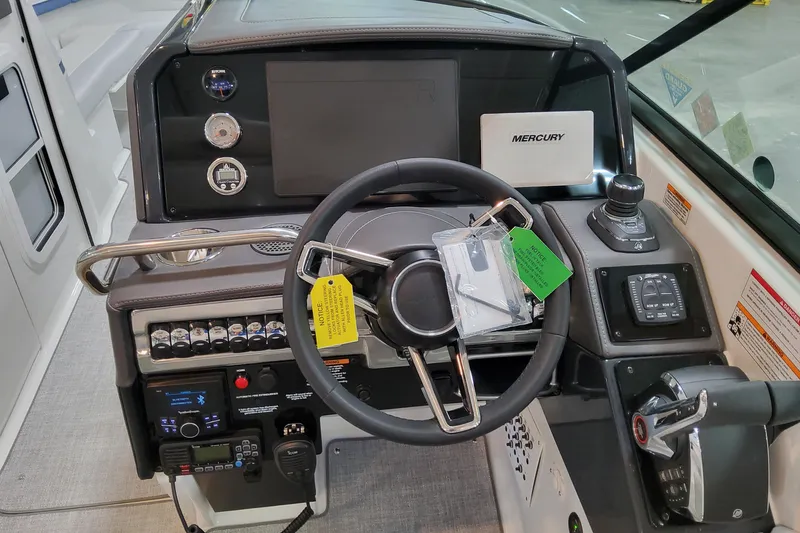 Slide: The Image of 2026 Formula 310 Bowrider OB dashboard with steering wheel and control panel. - 52