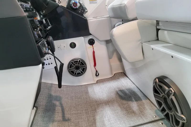 Slide: The Image of Interior of 2026 Formula 310 Bowrider OB boat, featuring control panel and speaker system. - 53