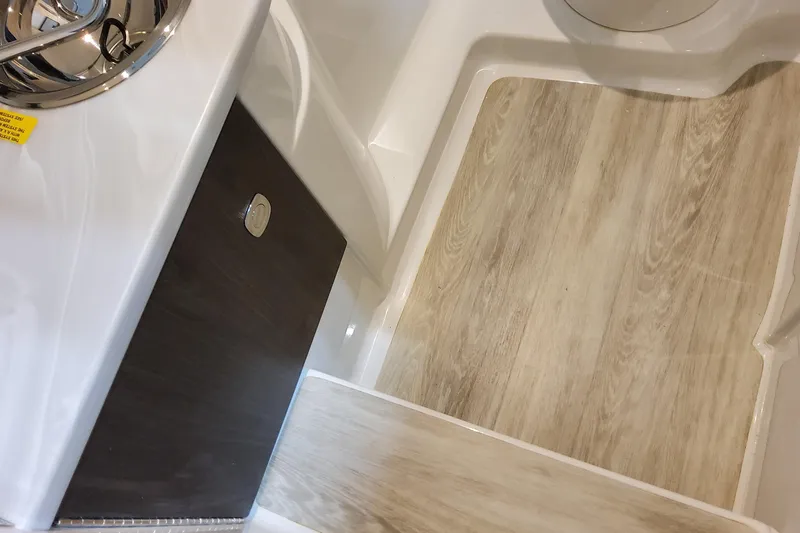 Slide: The Image of 2026 Formula 310 Bowrider OB interior with wood-style flooring and sleek design. - 55