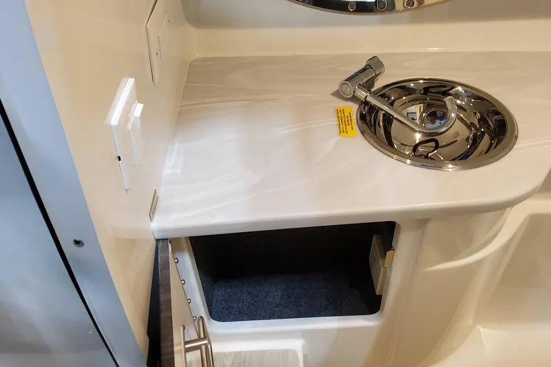 Slide: The Image of 2026 Formula 310 Bowrider OB interior sink and countertop detail. - 59