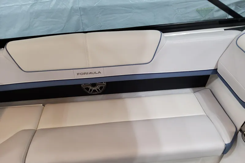 Slide: The Image of 2026 Formula 310 Bowrider OB interior seating with elegant white and blue upholstery. - 61