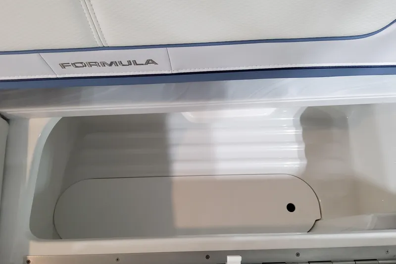 Slide: The Image of 2026 Formula 310 Bowrider OB storage compartment with sleek interior design. - 63
