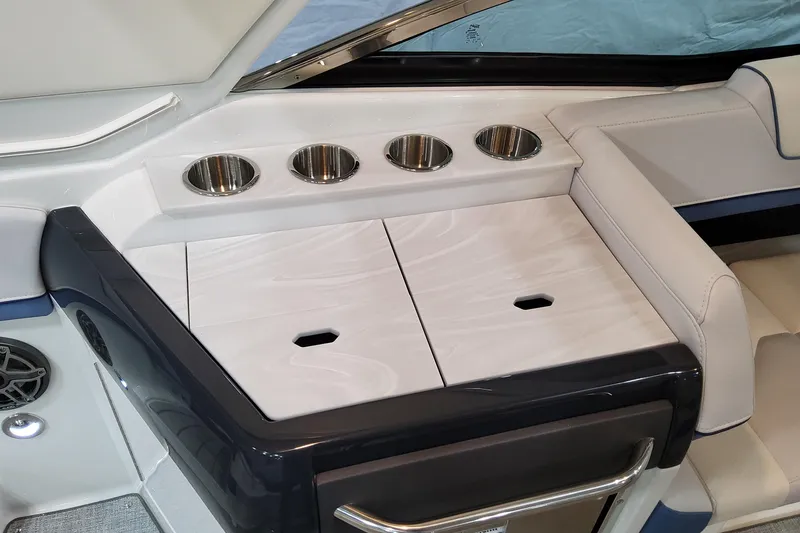 Slide: The Image of 2026 Formula 310 Bowrider OB interior with cup holders and sleek seating design. - 66