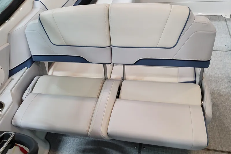 Slide: The Image of 2026 Formula 310 Bowrider OB interior seating, featuring luxurious white and blue upholstery. - 70