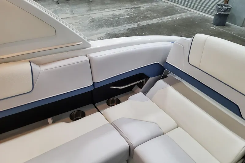 Slide: The Image of Luxurious seating in 2026 Formula 310 Bowrider OB boat, featuring elegant design and cup holders. - 75