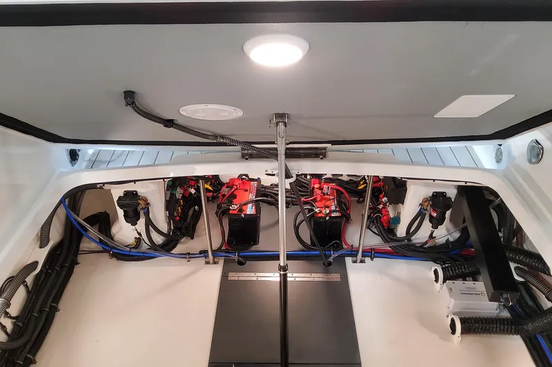 Slide: The Image of 2026 Formula 310 Bowrider OB engine compartment with wiring and components. - 81