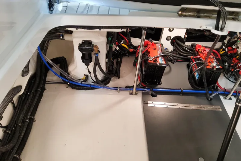 Slide: The Image of Engine compartment of 2026 Formula 310 Bowrider OB, showcasing wiring and battery setup. - 85