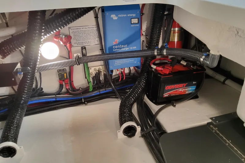 Slide: The Image of Engine compartment of 2026 Formula 310 Bowrider OB with battery and wiring system. - 86