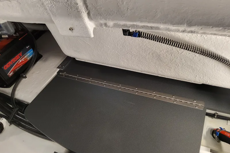 Slide: The Image of Interior view of 2026 Formula 310 Bowrider OB boat, featuring battery and wiring. - 89