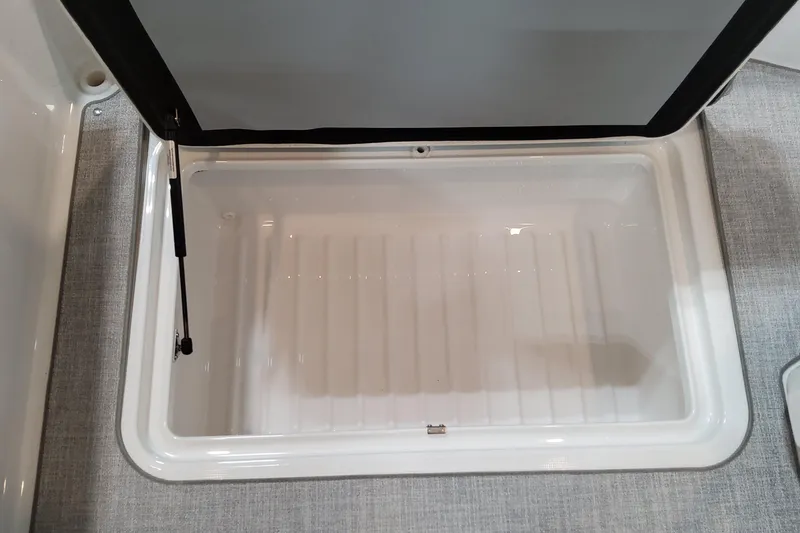 Slide: The Image of Open storage compartment in 2026 Formula 310 Bowrider OB boat. - 90