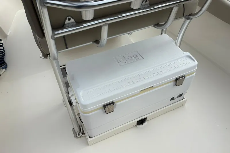 Slide: The Image of White Igloo cooler on 2023 Key West 219 FS boat, secured under a metal frame. - 18