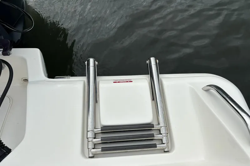 Slide: The Image of 2023 Key West 219 FS boat swim platform with stainless steel ladder. - 21