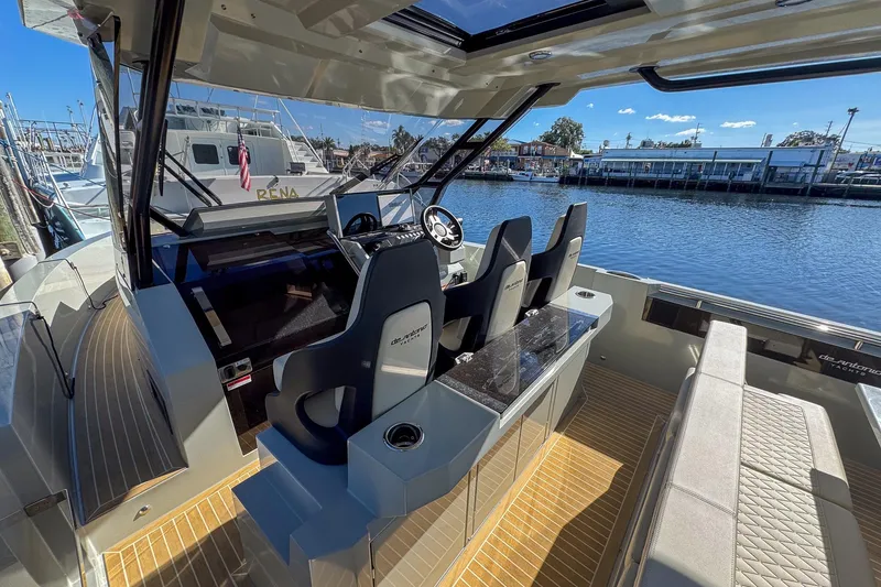 Slide: The Image of 2026 De Antonio Yachts D32 interior with sleek design and waterfront view. - 15