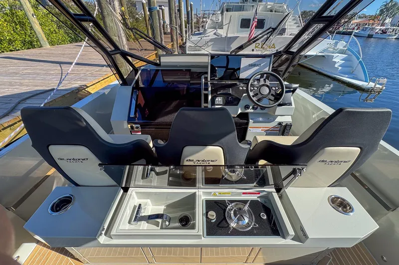 Slide: The Image of 2026 De Antonio Yachts D32 cockpit with modern helm, seating, and sleek design. - 16