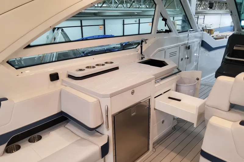 Slide: The Image of 2026 Formula 400 Super Sport Crossover yacht interior with sleek kitchenette and seating area. - 17