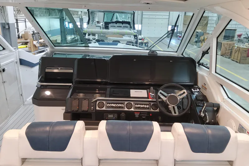 Slide: The Image of 2026 Formula 400 Super Sport Crossover cockpit with modern controls and steering wheel. - 20