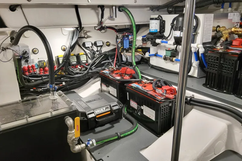 Slide: The Image of Engine room of 2026 Formula 400 Super Sport Crossover with batteries and wiring. - 27