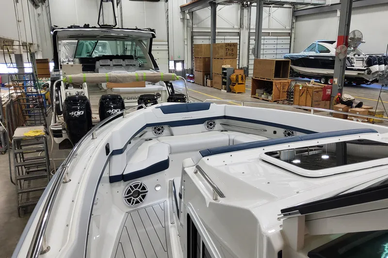 Slide: The Image of 2026 Formula 400 Super Sport Crossover in a boat manufacturing facility. - 29