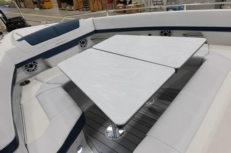 Slide: The Image of 2026 Formula 400 Super Sport Crossover boat interior with sleek seating and modern table design. - 31