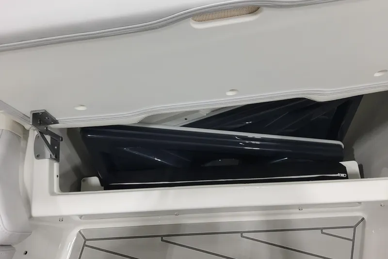 Slide: The Image of 2026 Formula 400 Super Sport Crossover storage compartment with open lid and interior view. - 33