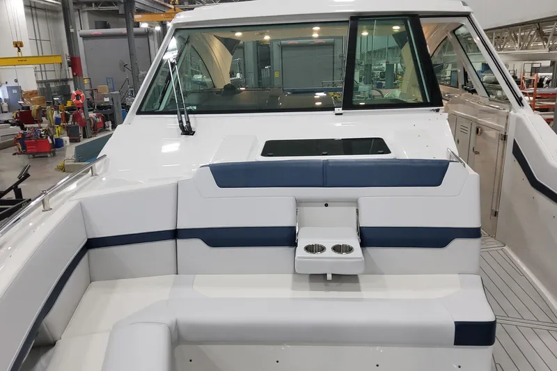 Slide: The Image of 2026 Formula 400 Super Sport Crossover boat interior with seating and cup holders. - 36