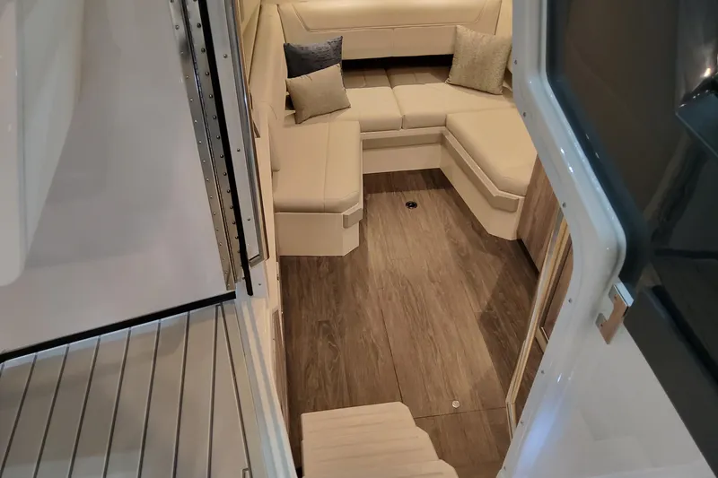 Slide: The Image of 2026 Formula 400 Super Sport Crossover interior with beige seating and wooden flooring. - 38