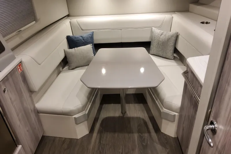 Slide: The Image of 2026 Formula 400 Super Sport Crossover interior with modern dining area and plush seating. - 40