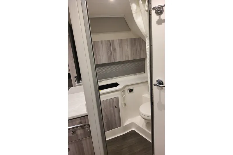 Slide: The Image of Interior of 2026 Formula 400 Super Sport Crossover boat bathroom, featuring modern design. - 47